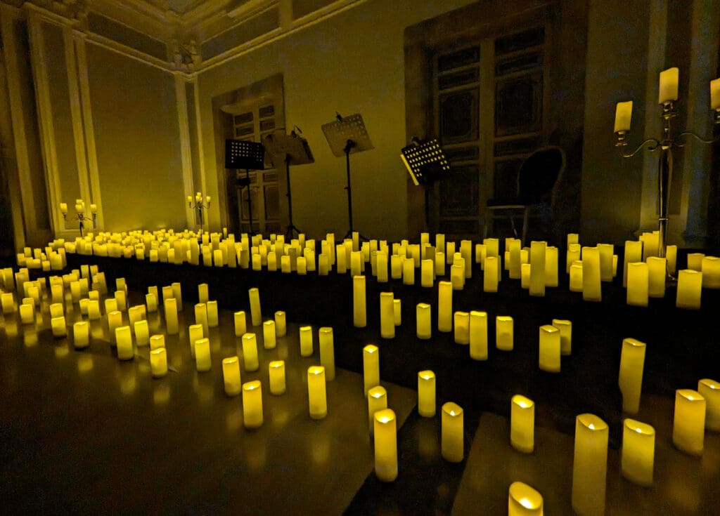 Hundreds of lit candles decorate the stage awaiting the orchestra to take the stage for the candlelight concert