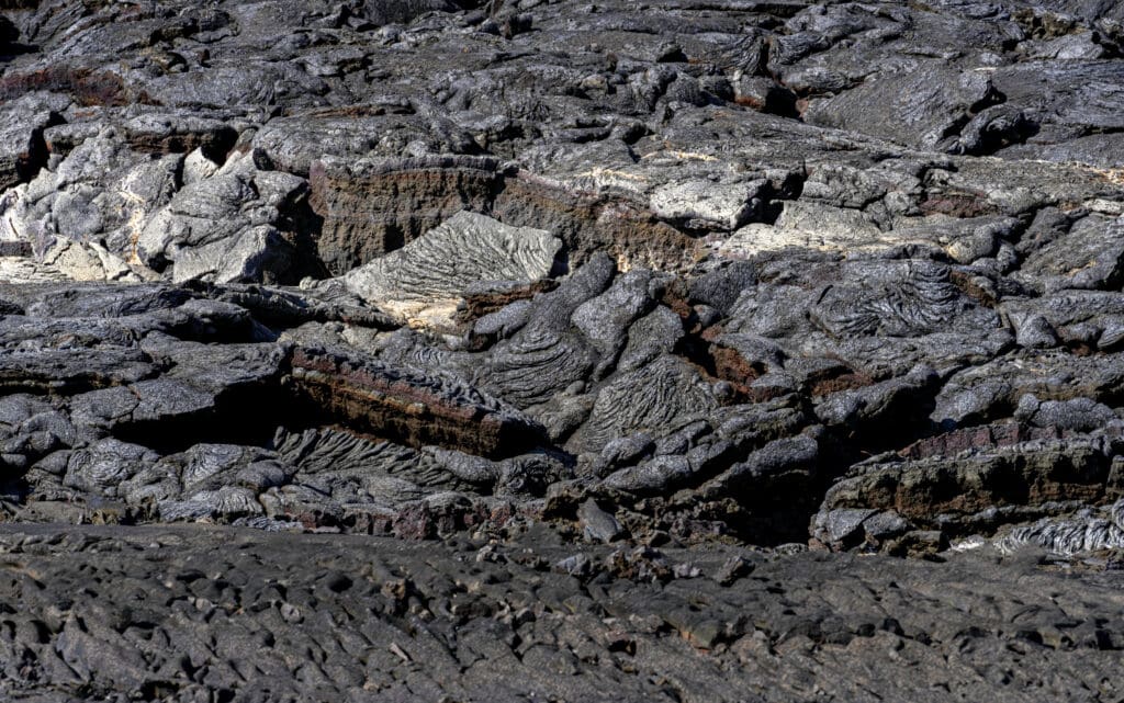 A large field of dried black bubbly and twisted lava in the Fagradalsfjall lava fields