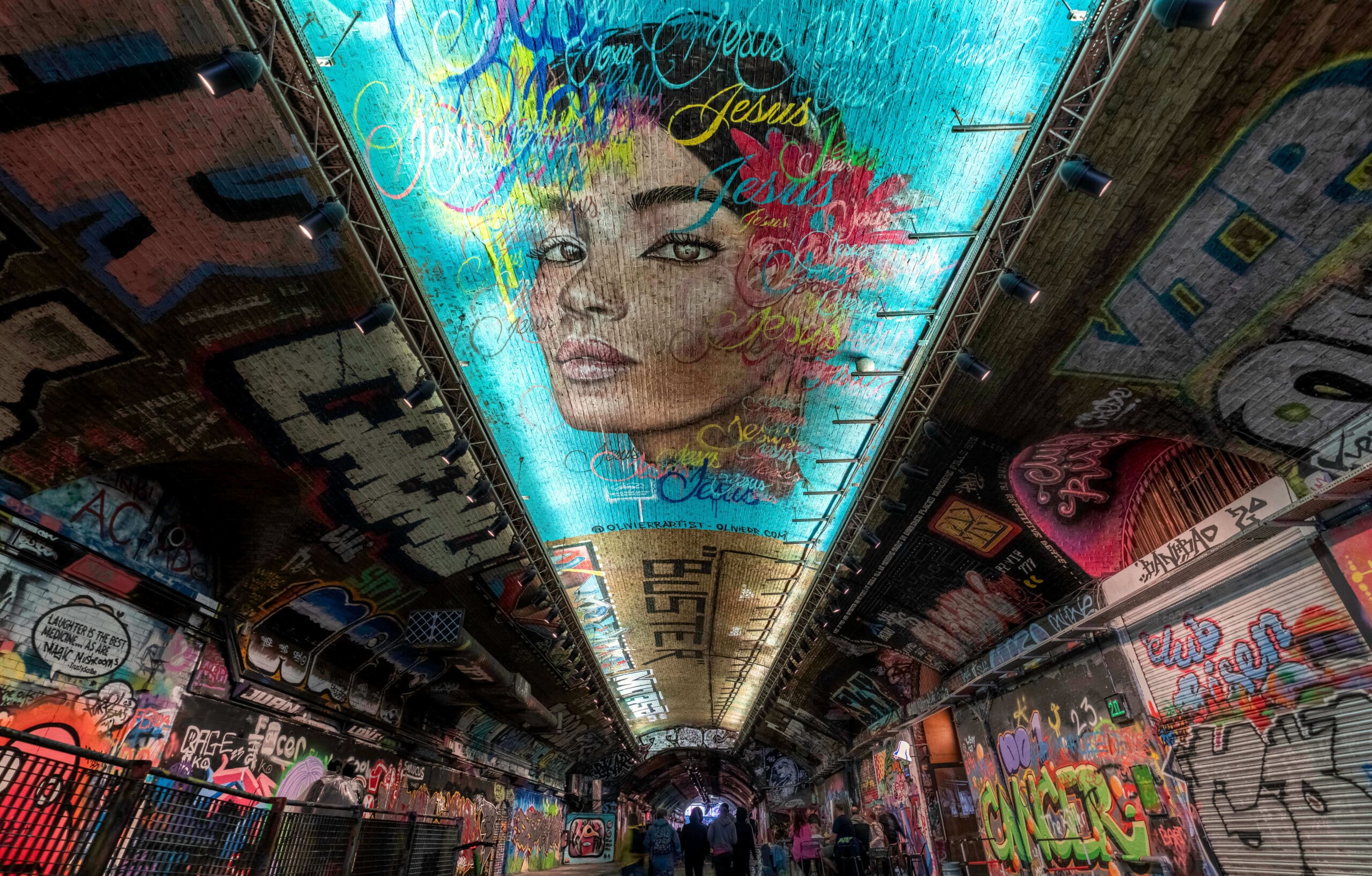 Beautiful vibrant graffiti lining an old subway tunnel named "The Vaults" underneath waterloo station