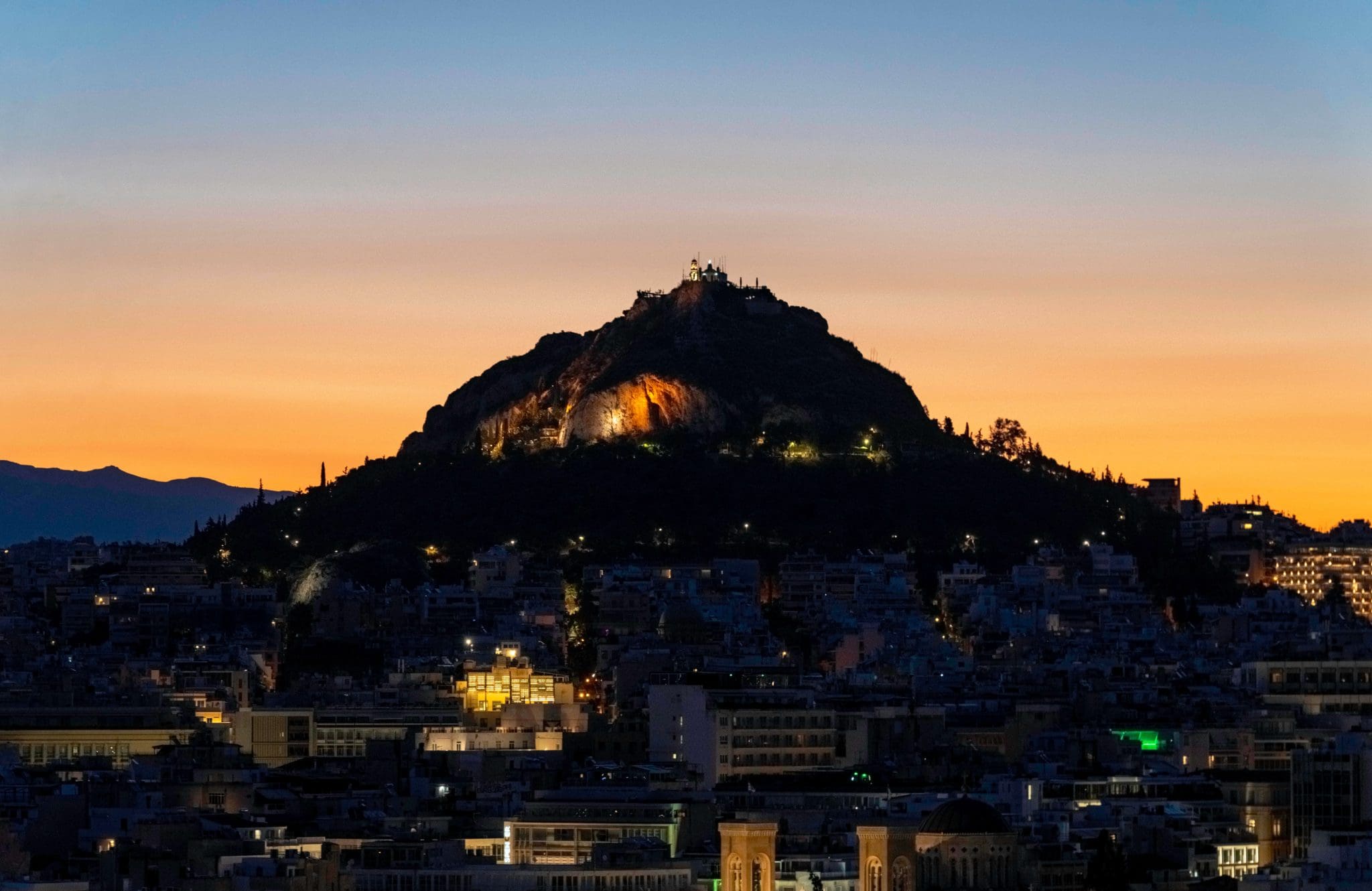 Watching the sunrise creep over the city of Athens from Areopagus Hill.