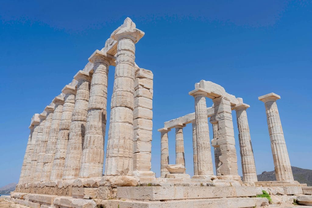 Near Athens you can find the large white columns standing together as the Temple of Poseidon.