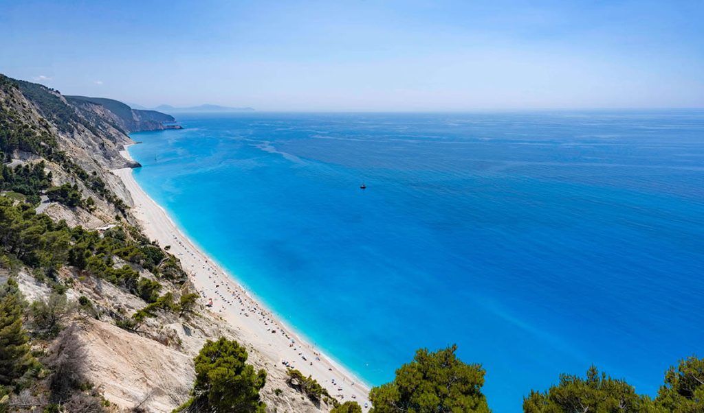 Long sandy beach meets the vibrant blue water makes one of the best Lefkada beaches and one of the best beaches in Greece and the world.