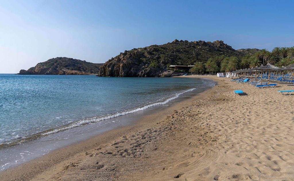 A mostly sandy beach with gentle waves at Vai Beach on Crete Island.