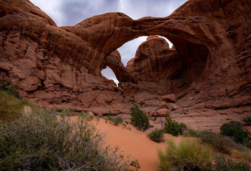 Under the massive double arch at the Arches national park, one of the best spots for Utah pictures.