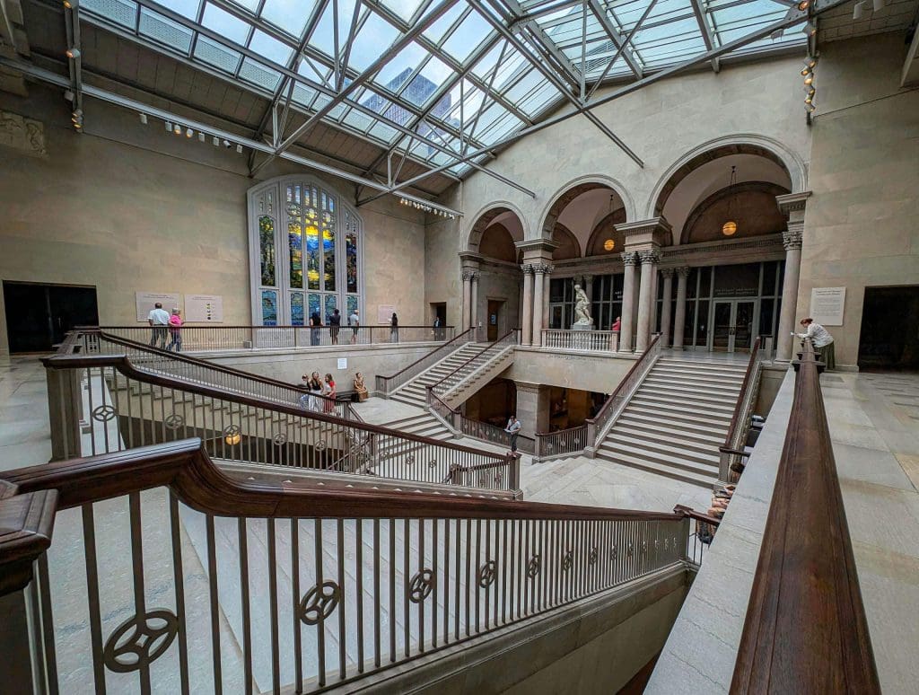 Fine staircases and stained glass windows inside the incredible Art Institute of Chicago, one of the most interesting things to do in Chicago.