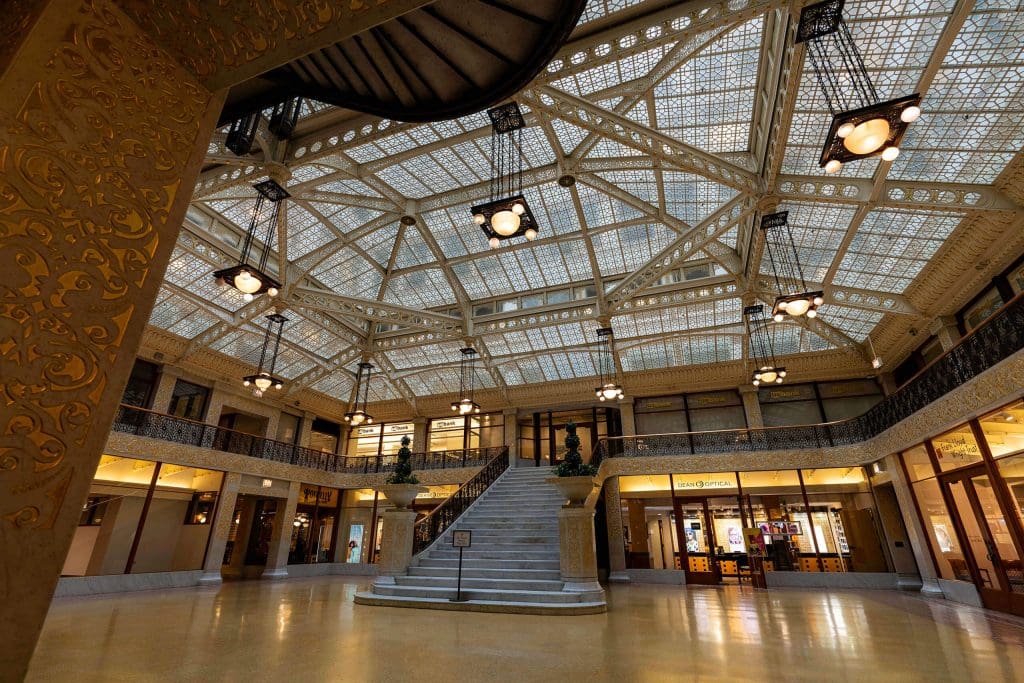 Looking up at the stunning glass ceiling design of the Rookery Building, one of the forerunners of Chicago like the Wrigley Building.