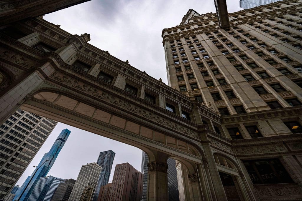 Looking up at the fine craftsmanship of the two towers and walkways of the Wrigley Building, one of the best photo spots in Chicago.