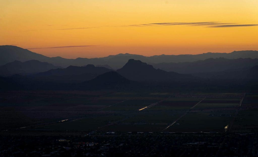 Seeing the warm colors and soft shadows in the distance from atop Camelback Mountain, the best photos of Phoenix.