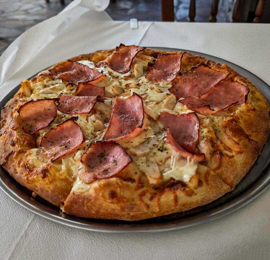 The large pizza at Plateia topped with tasty cheese and meats.