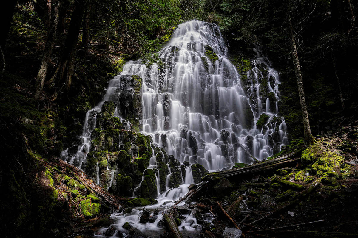 Water lightly runs down dark rocks in the perfect paradise that is Ramona falls, one of the best waterfalls in Oregon.