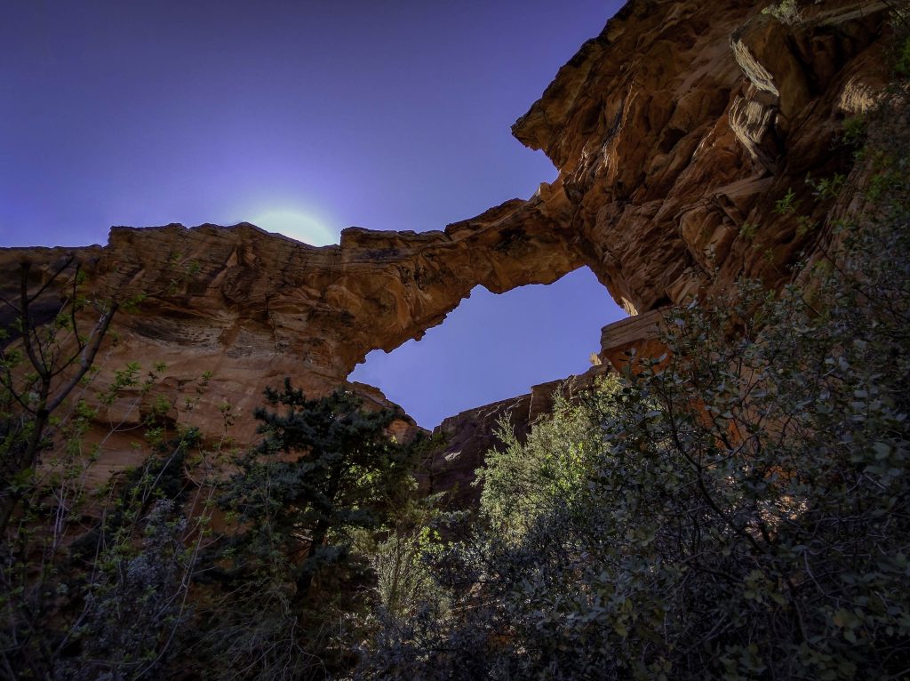 Looking up at the high Devil's Bridge natural arch in Sedona.