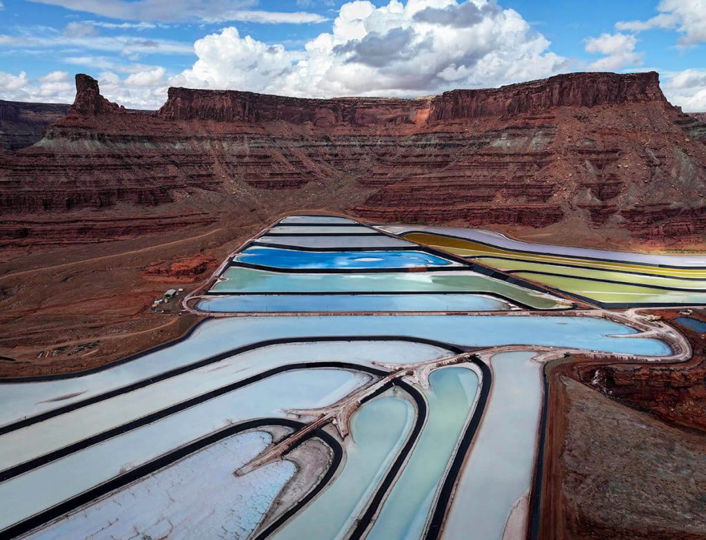 Mesmerizingly bright colors create a vibrant display right under the walls of red rock canyons.