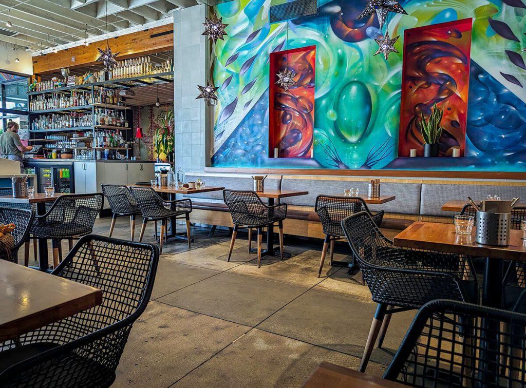 Brightly colored walls and designs make up the interior of Guerilla Tacos a delicious unique restaurant in Los Angeles.