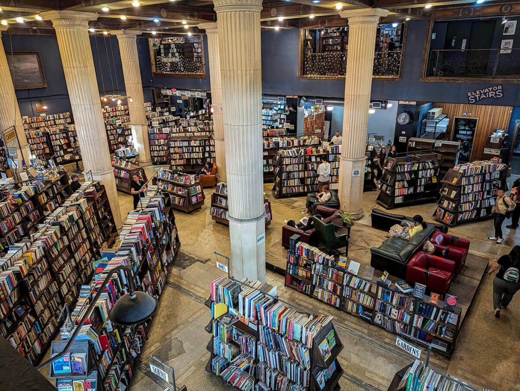 Looking down from the second level to see thousands of books on shelves at the Last Bookstore.