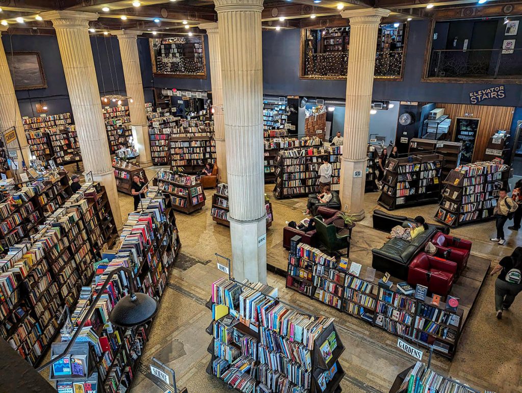 Looking down to the first floor to see thousands of books resting on shelves inside The Last Bookstore in Los Angeles.