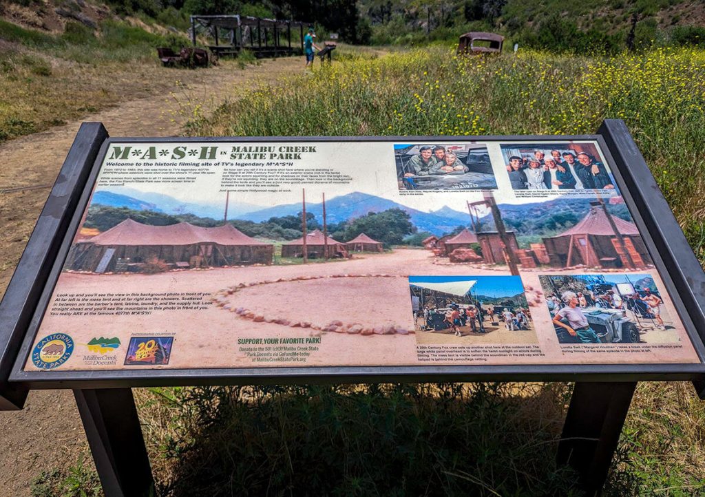 A sign showing what the set of MASH looked like during the time of shooting at this spot in Malibu Creek State Park.
