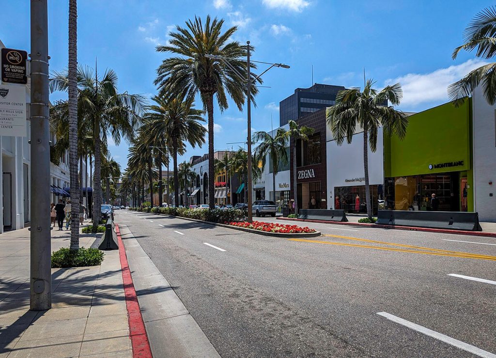 The open and glamorous street of Rodeo Drive with palm trees and designer stores show why it is a one in a lifetime thing to do in Los Angeles.