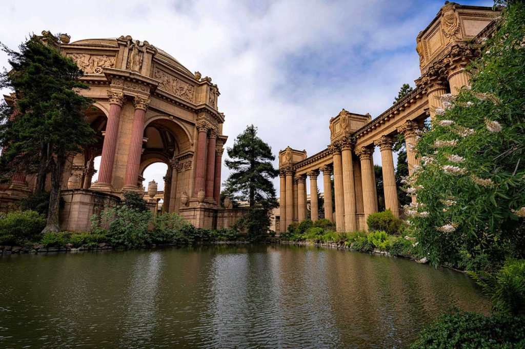 Still water rests under the tall pillars of the stunning Palace of Fine Arts in San Francisco.