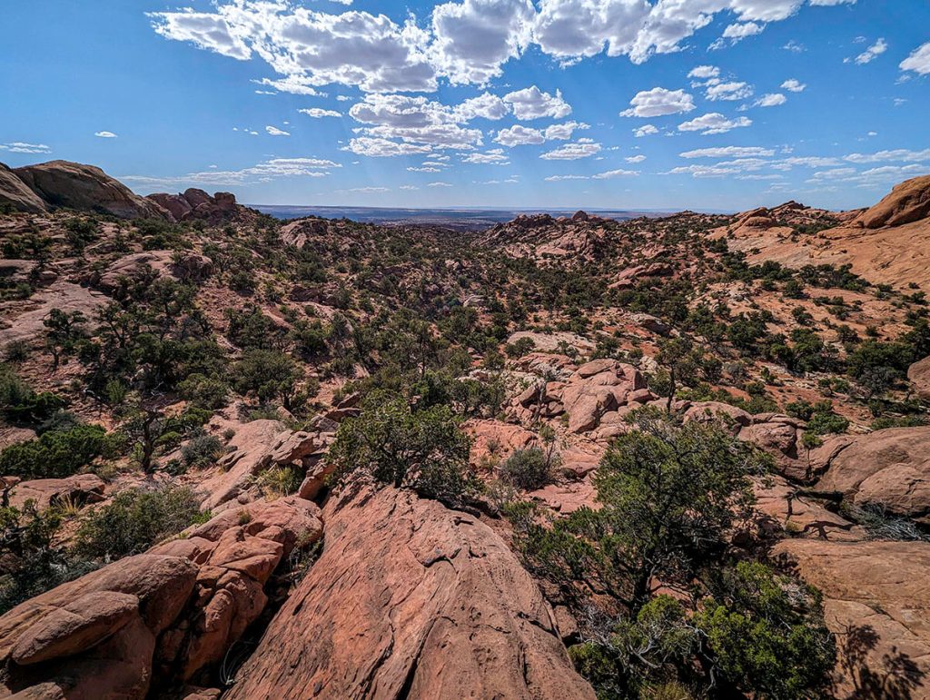 Looking over the dry desert landscape surrounding the Upheaval Dome, one of the more secluded Canyonlands hikes.