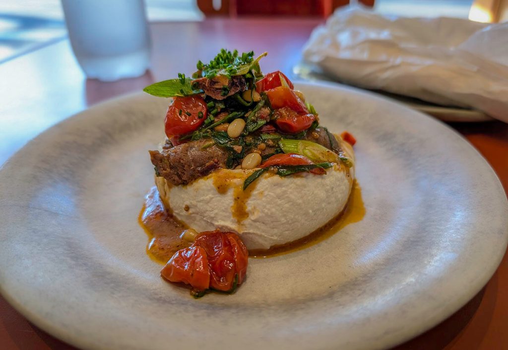 Looking at the Sujuk dish at Kubri, a great place when looking for where to eat in Paris.