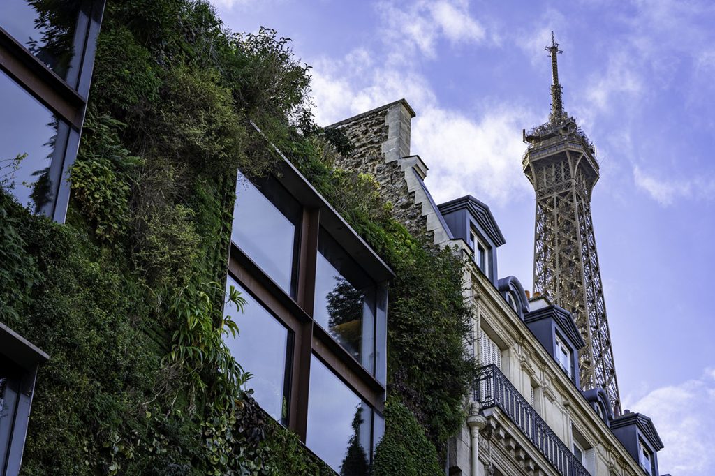 A plant covered building makes for one of the more interesting Eiffel Tower views found in Paris.