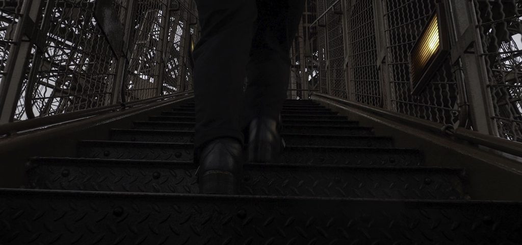 Walking up the stairs in the inner workings of the Eiffel Tower.