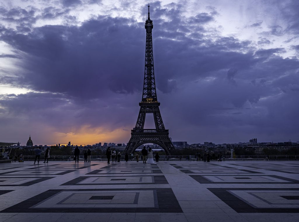 One of the best Eiffel Tower views, the open square shows a clear view as the sun rises in the distance.